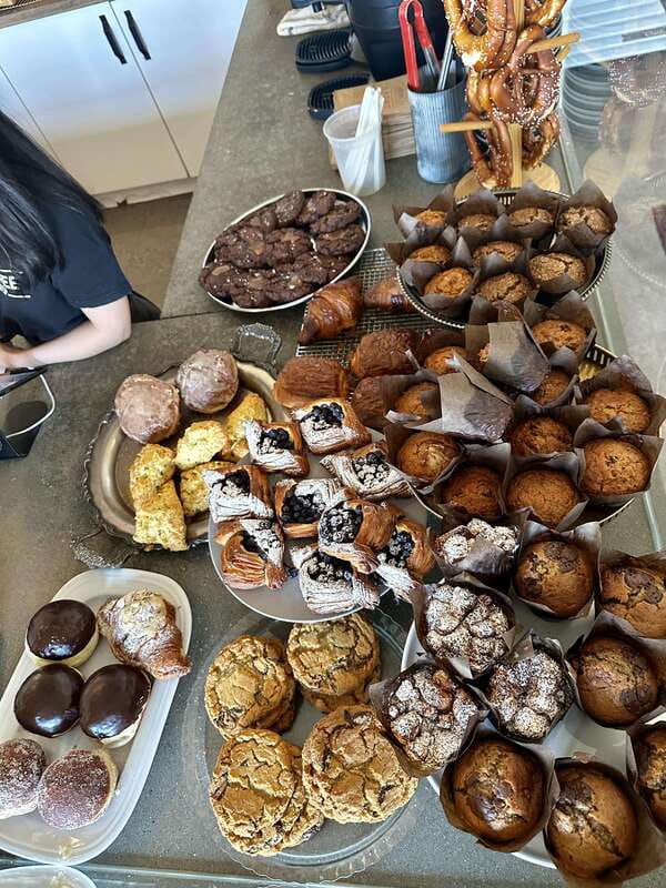 Kelowna: Walking Food Tour with 7 Tastings and 4 Drinks - Waterfront Park tasting stop: where the trip shifts from sights to bites