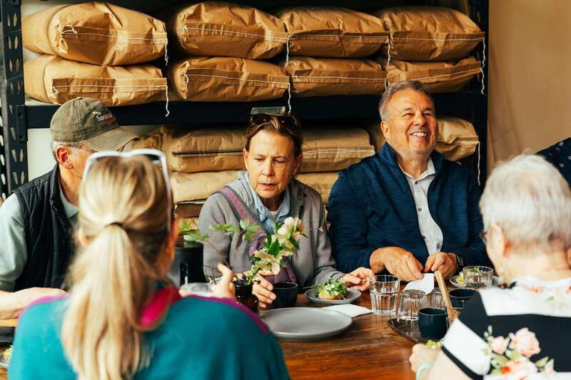 Kelowna: Walking Food Tour with 7 Tastings and 4 Drinks - Starting at the Laurel Packinghouse, and meeting Andrew the guide