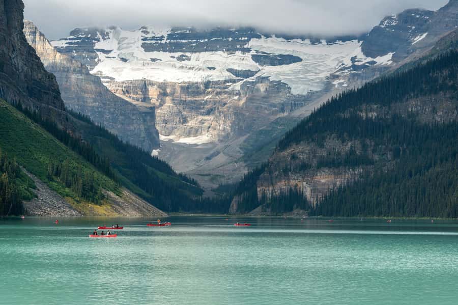 Canoes on Lake Louise below the Victoria Glacier