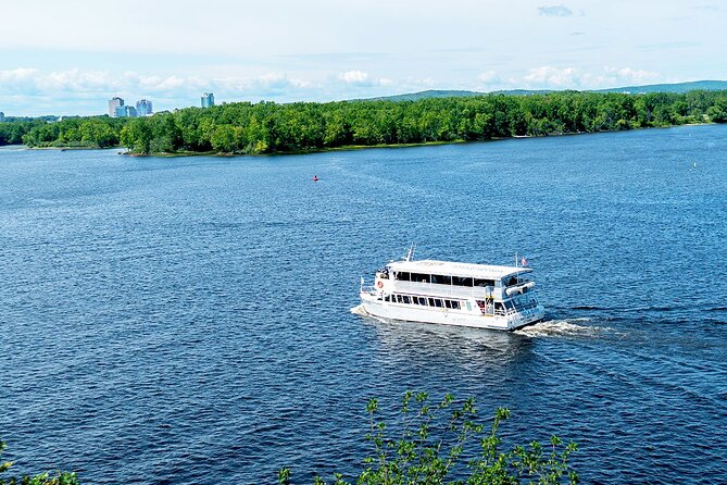 Ottawa Boat Cruise - Paul's Boat Line - The river view of Parliament Hill, Supreme Court, and the Mint
