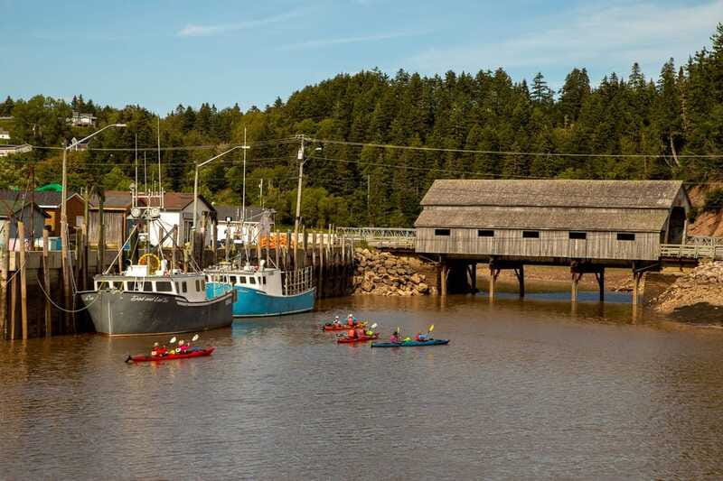 Saint John: Guided Kayaking Tour of St. Martins Sea Caves - Paddling out past harbour details you can actually read