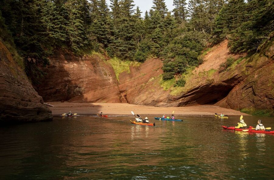 Saint John: Guided Kayaking Tour of St. Martins Sea Caves - Riding the Fundy tides into the caves