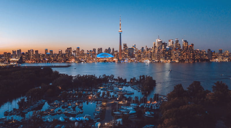 Toronto: Small Group Night Tour with Harbour Boat Cruise - Distillery District After Dark: Cobblestones, Shops, and Your Pace